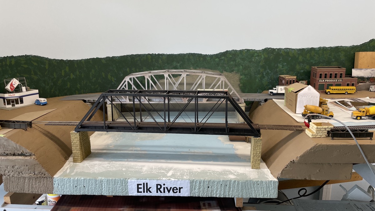 Bridges to hide transition of river to backdrop.