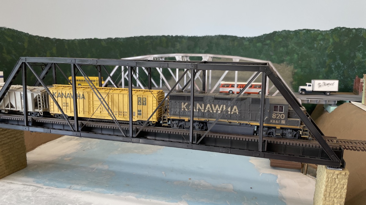 Engine and cars placed for photo.