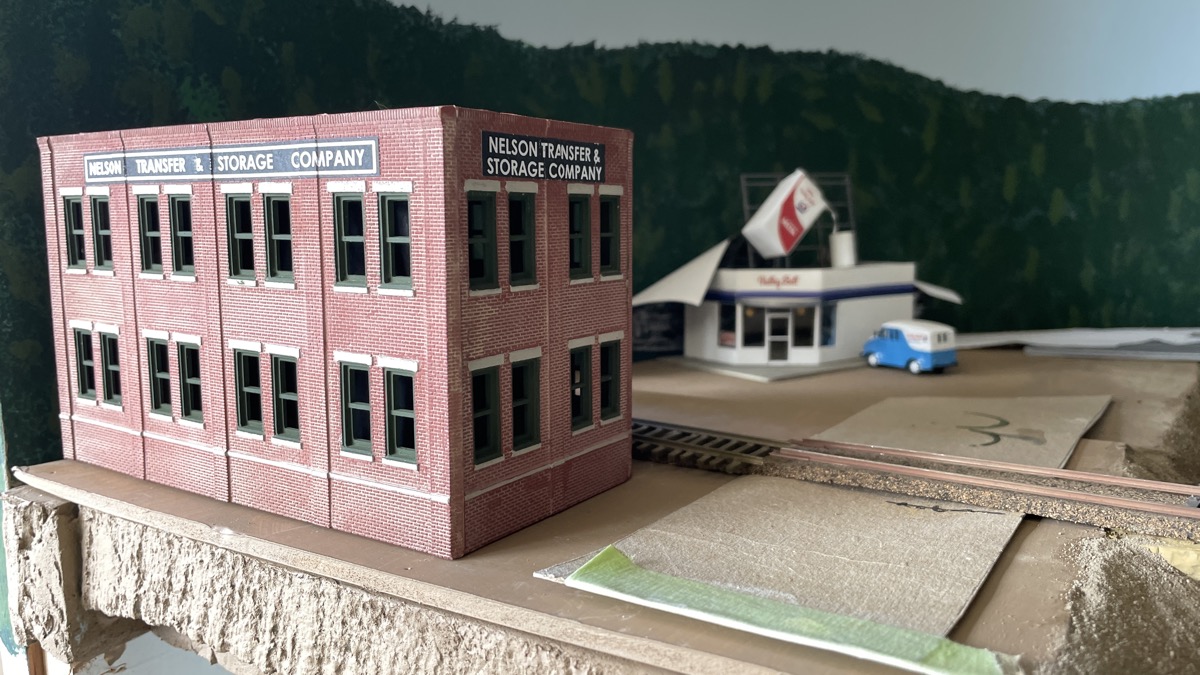 Nelson Moving and Storage buiilding to block view of backdrop hole for trains.