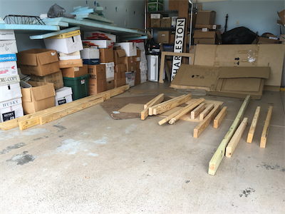 Wood scavenged (with permission) from a dumpster at a nearby home construction site. Many nails to remove.