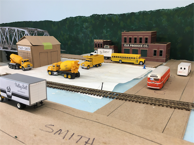 Vehicles being collected, painted, and lettered to represent Charleston, WV area businesses.