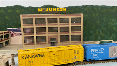 A Kanawha boxcar passing the McJunkin building in Charleston.